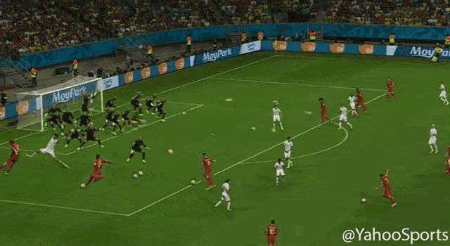 a soccer game is being played in front of a banner that says meupark on it