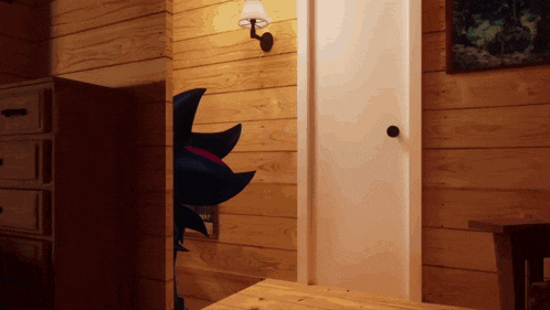 a wooden wall with a lamp and a pinwheel on it