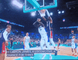 a basketball game is being played and lebron james is dunking