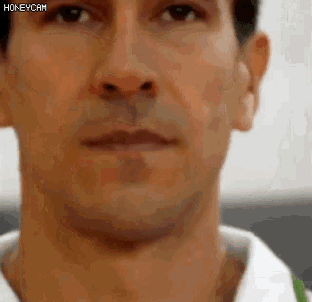 a close up of a man 's face with a honeycam watermark