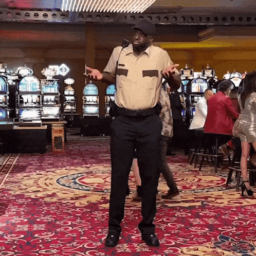 a man in a security uniform stands in front of a casino
