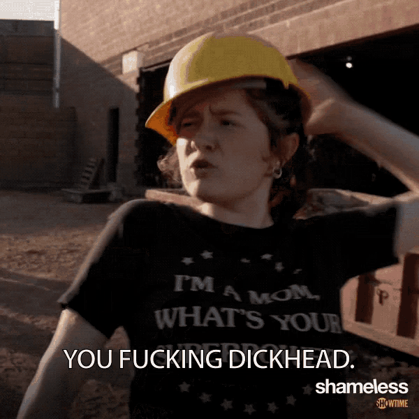 a woman wearing a hard hat says you fucking dickhead
