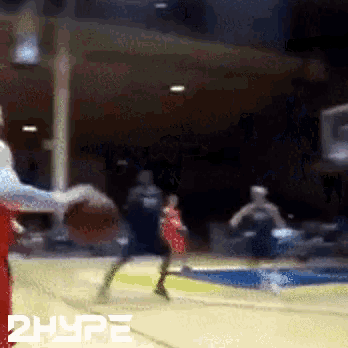 a blurry picture of a basketball game with the word hype on the bottom right
