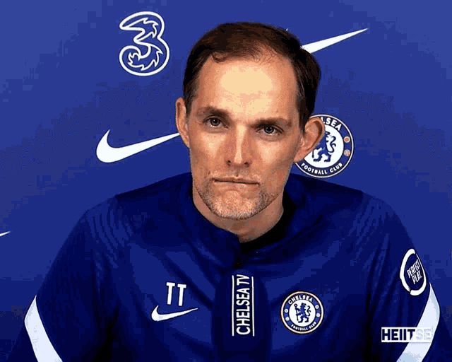 a man wearing a blue chelsea tv jacket