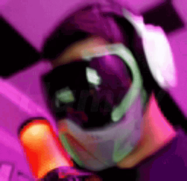 a purple background with a person wearing a helmet and headphones