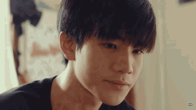 a close up of a young man 's face with a watermark that says ' i ' on it