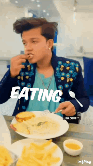 a man sitting at a table with a plate of food with the word eating on it