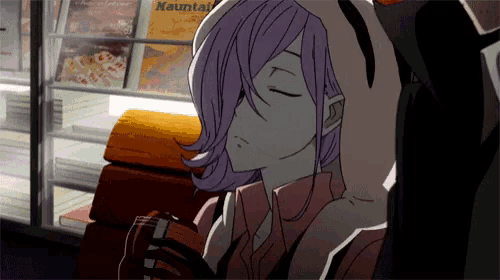a girl with purple hair is sleeping in front of a book shelf with nauntai on it