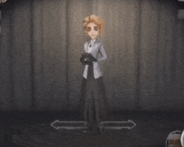 a person is standing in a dark room with a light coming out of their hand and a letter c on their chest .