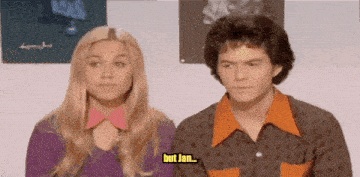 a man and a woman are standing next to each other and the woman says but jan .