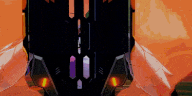 a close up of a futuristic looking object with a purple and orange light
