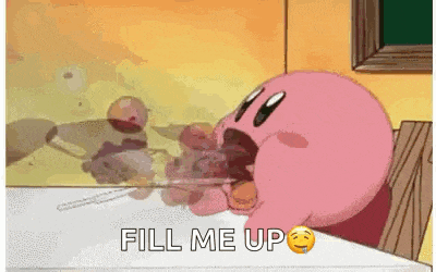 kirby is sitting at a table with a spoon in his mouth and the words `` fill me up '' .