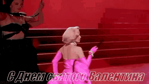 a woman in a pink dress and pink gloves is dancing on a red staircase