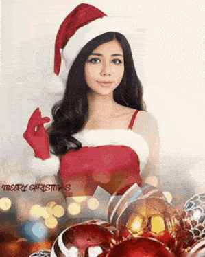a woman wearing a santa hat and gloves with the words merry christmas below her