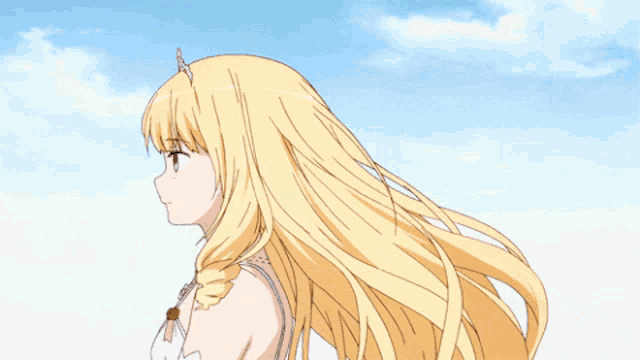 a girl with long blonde hair and a unicorn crown on her head