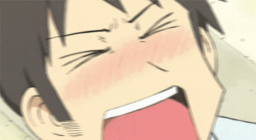 a close up of a man 's face with his mouth wide open