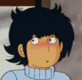a cartoon character with black hair and a blue sweater has his eyes wide open