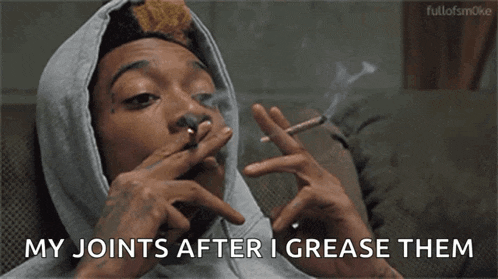 a man is smoking a cigarette and saying `` my joints after i grease them ''