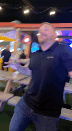 a man in a black polo shirt with the word north face on it