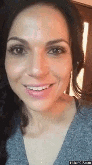 a close up of a woman 's face with makeagif.com at the bottom of the image