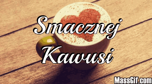 a cup of cappuccino with a heart in the foam and the words smacznej kawusi