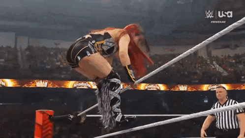 a woman in a wrestling ring with the words raw women 's tournament