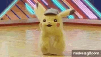 a pikachu doll is dancing on a stage in front of a neon sign .