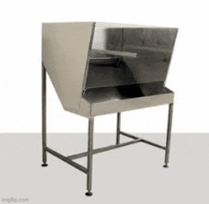 a stainless steel table with a hood on top of it .