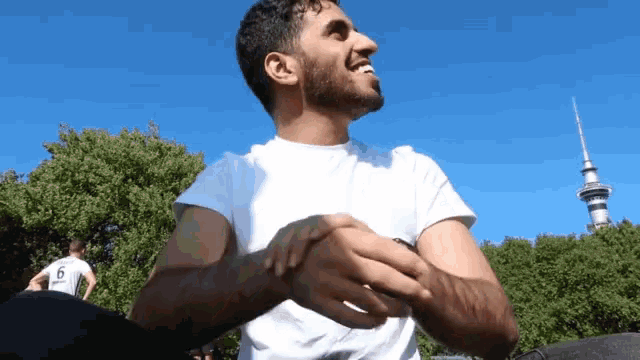 a man in a white shirt with the number 5 on his back