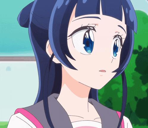 a close up of a girl 's face with blue hair