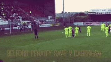 a soccer field with the words belford penalty save v dagenham