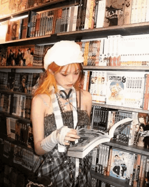 a girl is reading a book in a library with a book called samurai 8