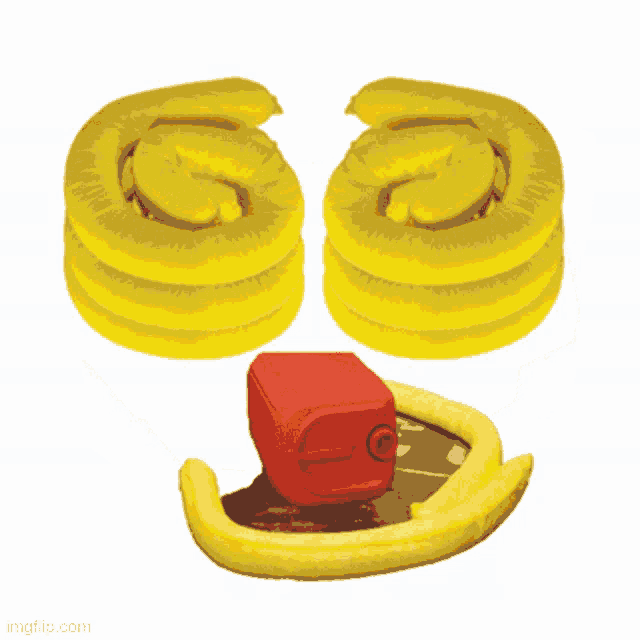 a stack of yellow swirls with a red barrel in the middle