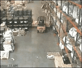a forklift in a warehouse with the website www.jj.am visible in the corner
