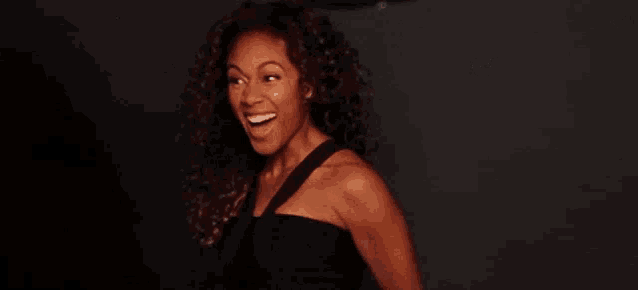 a woman is smiling in front of a black background with the words indicues give away of $ 3000 cash price on mother 's day