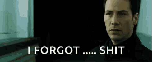 a man in a black suit is saying `` i forgot ... shit '' in a dark room .