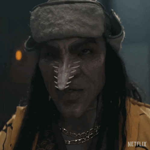 a close up of a person with a netflix logo on the bottom