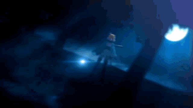 a person holding a sword in the dark