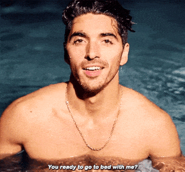 a shirtless man in a pool with the words " you ready to go to bed with me " below him