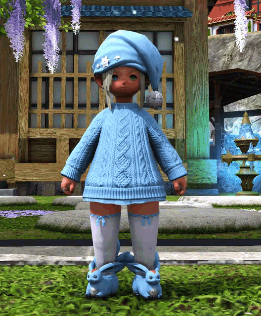 a little girl wearing a blue sweater and white socks stands in front of a building