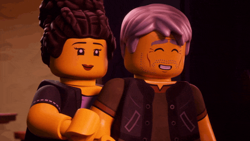 a man and a woman are standing next to each other and the man is smiling