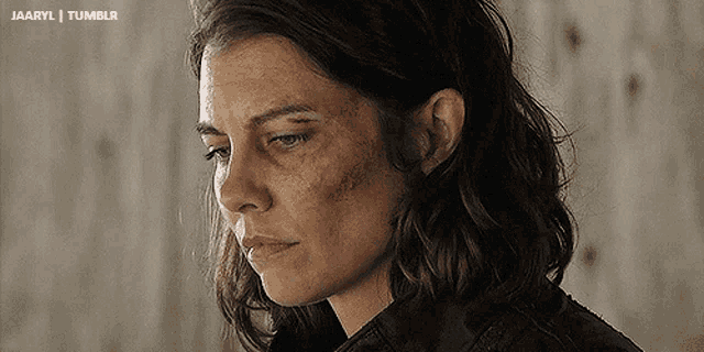 a close up of a woman 's face with a tumblr logo in the upper left corner