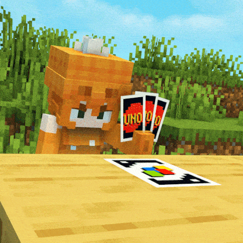 a minecraft character holding a stack of uno cards on a table