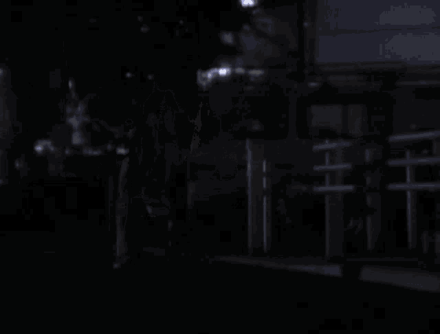 a blurry photo of a street at night