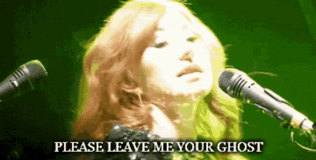 a woman singing into a microphone with the words please leave me your ghost