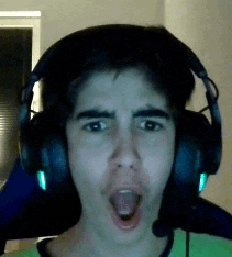 a young man wearing headphones and a green shirt is making a funny face