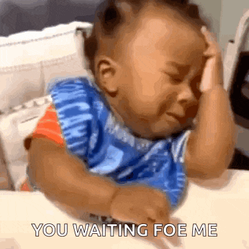 a baby is crying while sitting at a table and the words you waiting for me are on the bottom
