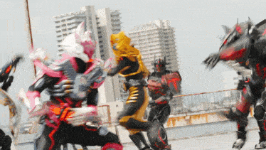 a group of superheros are fighting on a rooftop with a building in the background
