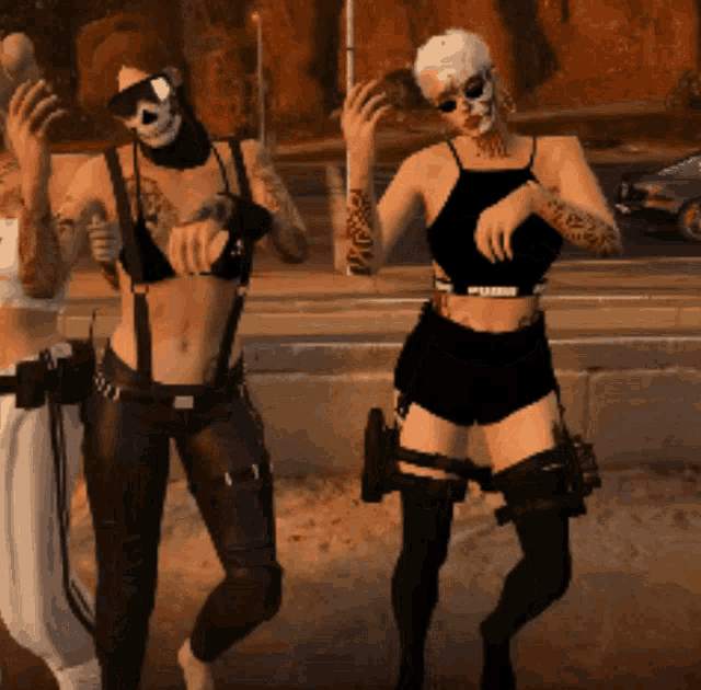 two women are standing next to each other and one of them has a skull on her face
