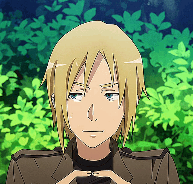 a boy with blonde hair and blue eyes is making a funny face